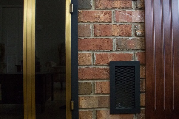 Grenier & Grenier, maçonnerie à Québec, maçonnerie, Québec, réalisations, résidentiel, salon, cheminé, mur, brique projet