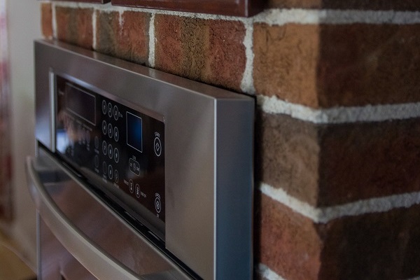 Grenier & Grenier, maçonnerie à Québec, maçonnerie, Québec, réalisations, résidentiel, salon, cheminé, mur, brique projet